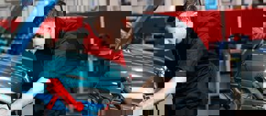 apprentice working on car engine