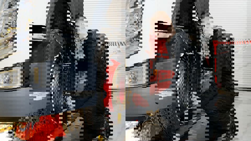 Apprentice inspecting LGV tyre