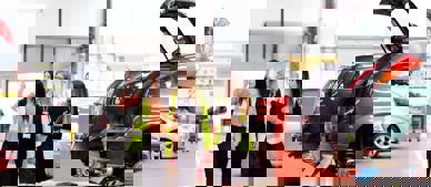 GTG Health and Safety advisors and client wearing hi-vis walking through workshop