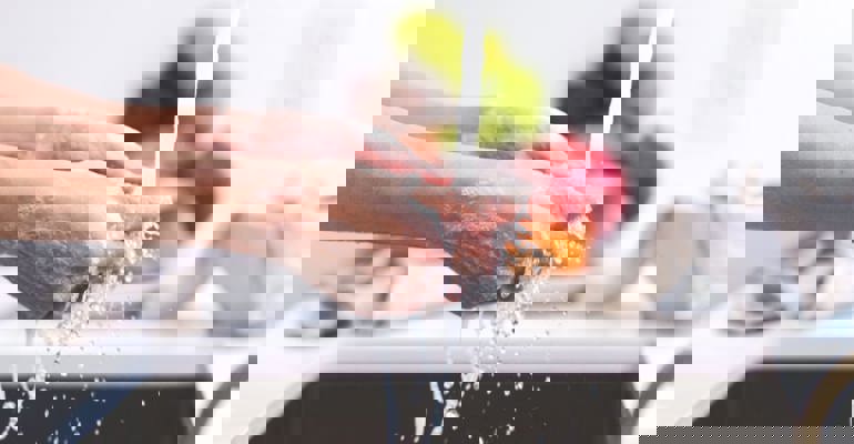 washing hands in sink