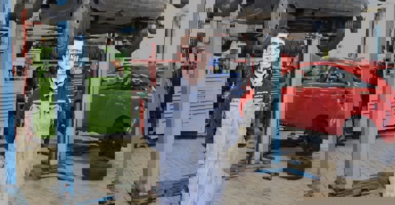 GTG Apprentice Harry in front of car ramp