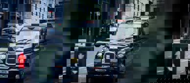 Black cab in city street