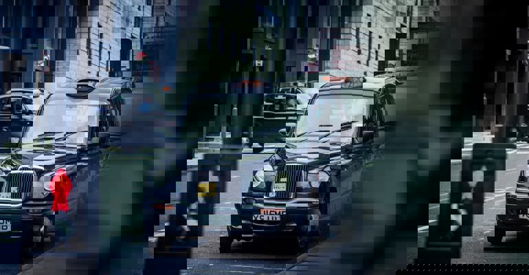 Black cab in city street