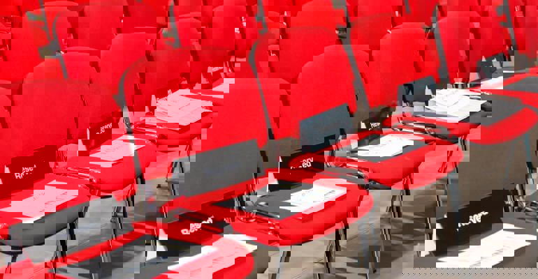 red chairs with reserved signs