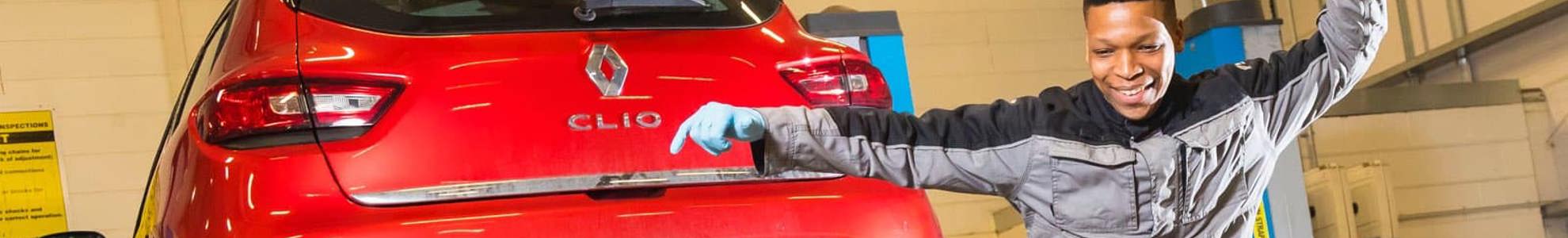 apprentice jumping in front of a car on a ramp