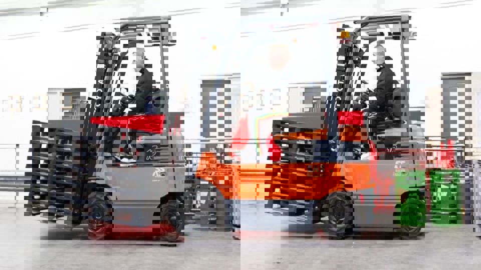 man driving a forklift