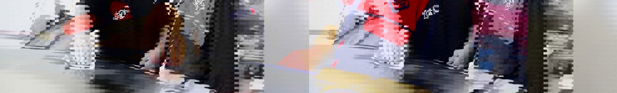 apprentice inspecting car paint job with GTG trainer