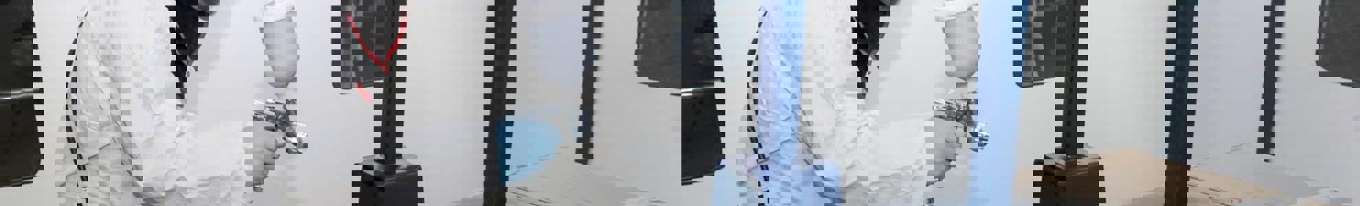 man in protective clothing inside paint booth at GTG West Midlands