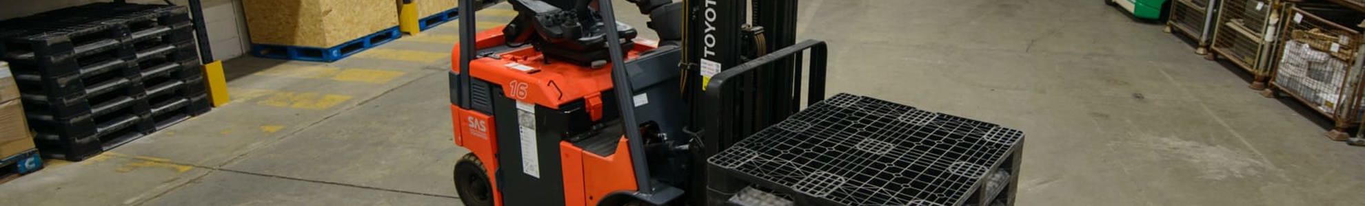 Forklift moving pallets